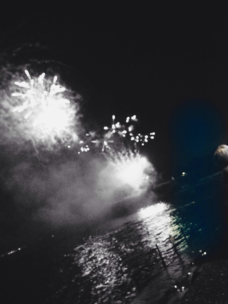 night, illuminated, glowing, motion, long exposure, firework display, exploding, sparks, blurred motion, firework - man made object, light - natural phenomenon, outdoors, water, lighting equipment, sky, celebration, street light, lens flare, firework, dark