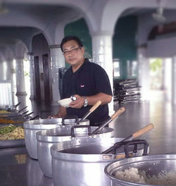 Mid adult man preparing food in kitchen