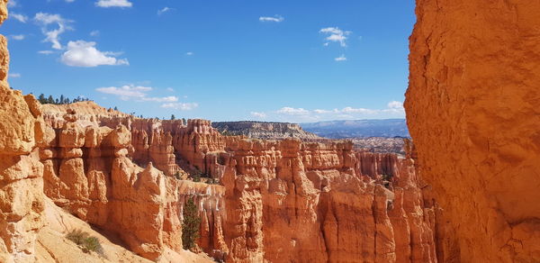 Panoramic view of rock formations against sky