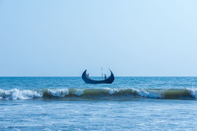 Boat in sea against clear sky