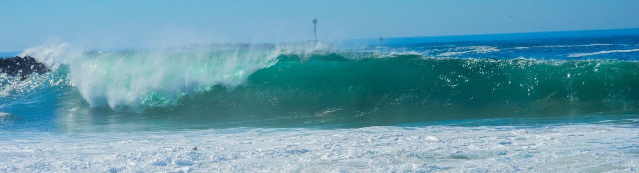 water, clear sky, motion, sea, blue, splashing, scenics, beauty in nature, surf, power in nature, nature, wave, waterfront, spraying, sky, day, travel, travel destinations, tranquil scene, tourism