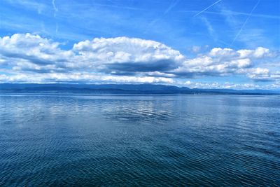 Scenic view of sea against blue sky