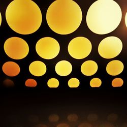 Close-up of electric lamp against black background