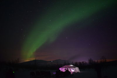 Scenic view of star field and northern lights at night