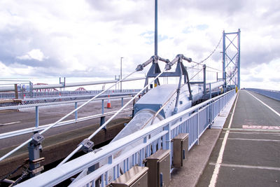 View of bridge against cloudy sky