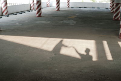 Shadow of people on road