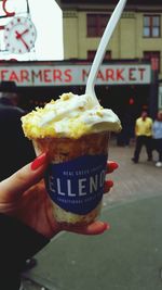 Close-up of hand holding ice cream