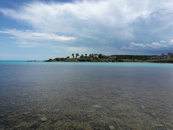 Scenic view of sea against cloudy sky