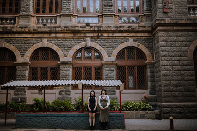 Statue in front of building