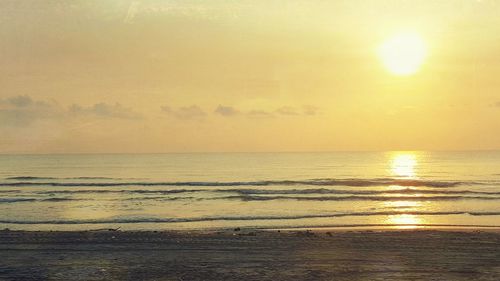 Scenic view of sea at sunset