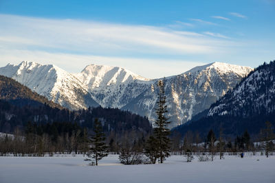 Scenic view of snowcapped mountains against sky during winter