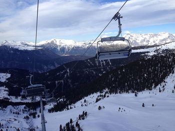 Overhead cable cars over snow covered landscape