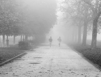 Two men running in the park