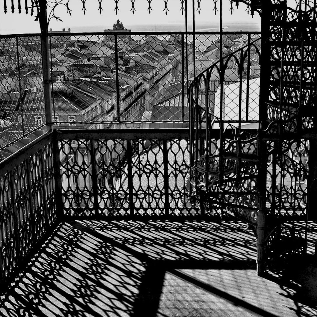 architecture, built structure, pattern, railing, metal, indoors, design, building exterior, day, gate, architectural feature, no people, protection, sunlight, steps, shadow, chainlink fence, fence, safety, metallic