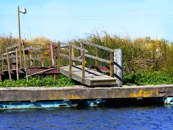 Built structure in water against clear sky