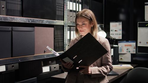 Portrait of young woman using digital tablet