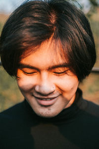 Close-up portrait of smiling young man