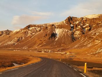 Road on mountain against sky