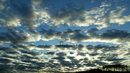 Sun shining through clouds