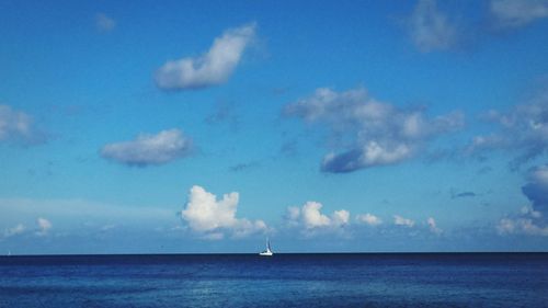 Scenic view of sea against blue sky