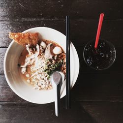 High angle view of food in bowl on wooden table