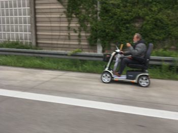 Rear view of a man on road