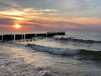 Scenic view of sea against sky during sunset