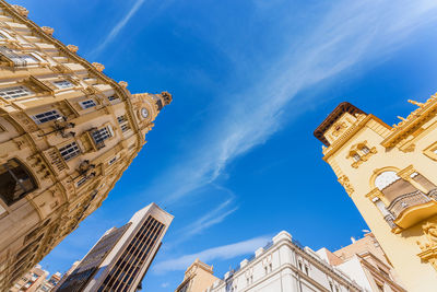 Low angle view of building against blue sky