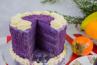 Close-up of cake and fruits on table during christmas