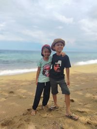 Full length portrait of boy on beach