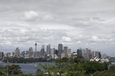 Distant view of sydney opera house and modern buildings
