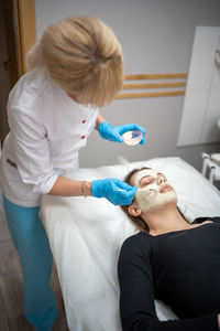 Doctor examining patient at clinic