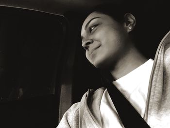 Young woman with eyes closed at night