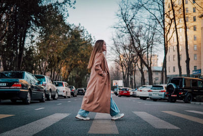 Woman standing on city street