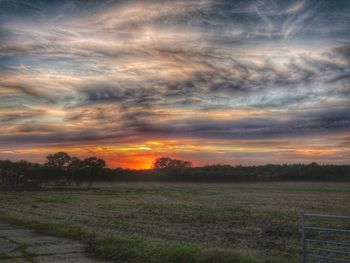 Scenic view of landscape against cloudy sky