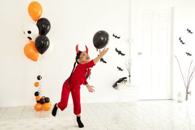Girl playing with balloons