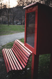 Close-up of empty bench in park