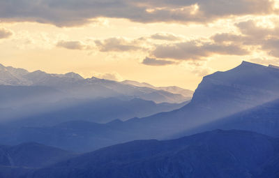 Scenic view of mountains against sky during sunset