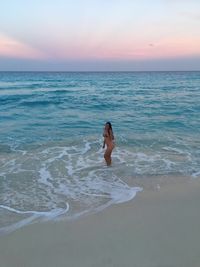 Full length of man on beach against sky