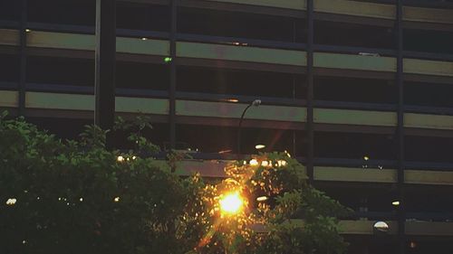 Illuminated buildings in city at night