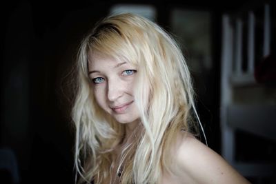 Close-up portrait of beautiful woman at home