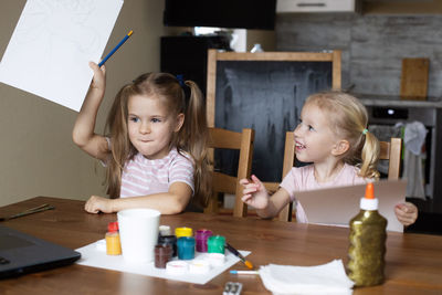 Portrait of boy playing with toys on table