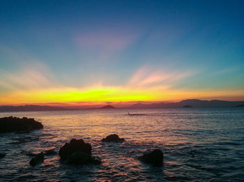 Scenic view of sea against sky during sunset