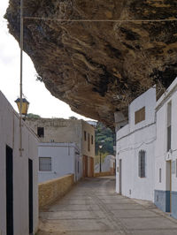 Empty alley amidst buildings in town