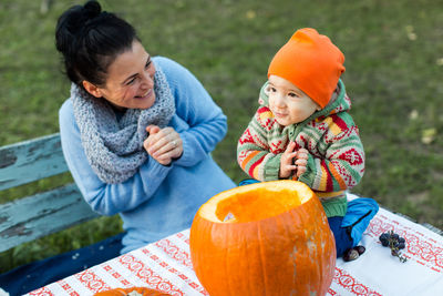 Mother and daughter in autumn garden