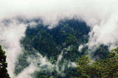 Scenic view of waterfall against sky