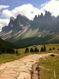 Scenic view of mountains against cloudy sky