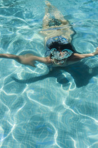 Young woman swimming in pool