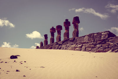 Panoramic view of stone wall on beach