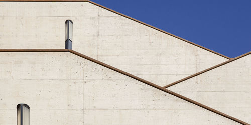 Low angle view of building against blue sky